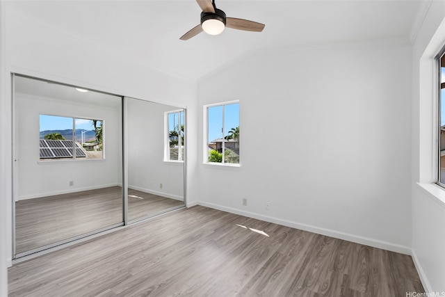 91-1041 Waihuna St, Ewa Beach, HI 96706 - unfurnished bedroom with ornamental molding, wood finished floors, lofted ceiling, a closet, and ceiling fan