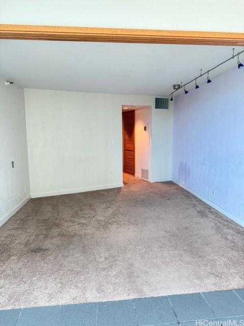 1330 Ala Moana Blvd Unit 1507, Honolulu, HI 96814 - unfurnished room with carpet, rail lighting, and baseboards