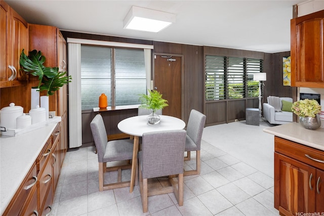 1456 Ala Aolani St, Honolulu, HI 96819 - dining space featuring wooden walls and light tile patterned flooring
