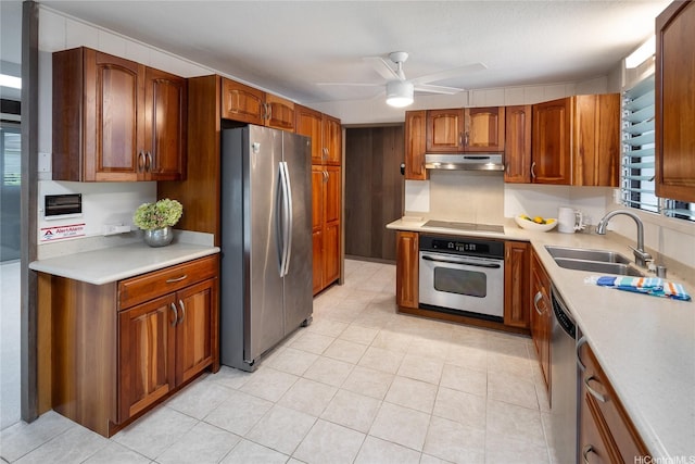 1456 Ala Aolani St, Honolulu, HI 96819 - kitchen with stainless steel appliances, under cabinet range hood, a ceiling fan, and light countertops