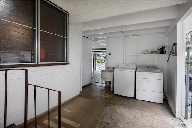 1456 Ala Aolani St, Honolulu, HI 96819 - laundry area with washing machine and clothes dryer and wooden walls