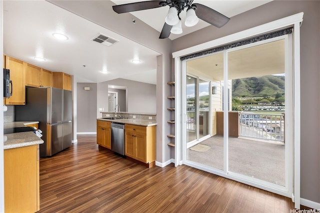 520 Lunalilo Home Rd Unit 7427, Honolulu, HI 96825 - kitchen with appliances with stainless steel finishes, dark wood-style floors, ceiling fan, and light stone counters