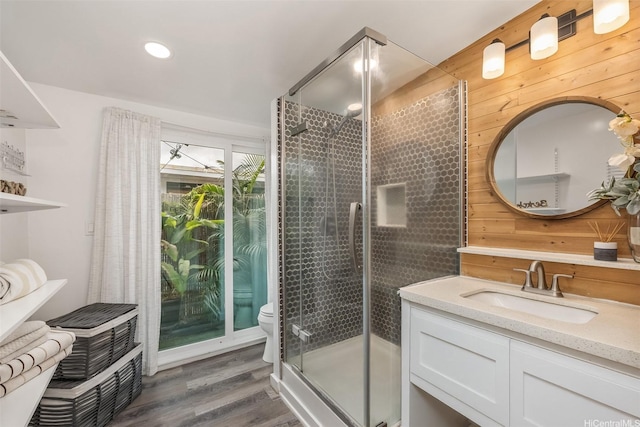 86-94 Pokai Bay St, Waianae, HI 96792 - bathroom featuring a shower stall, wood finished floors, vanity, wood walls, and recessed lighting