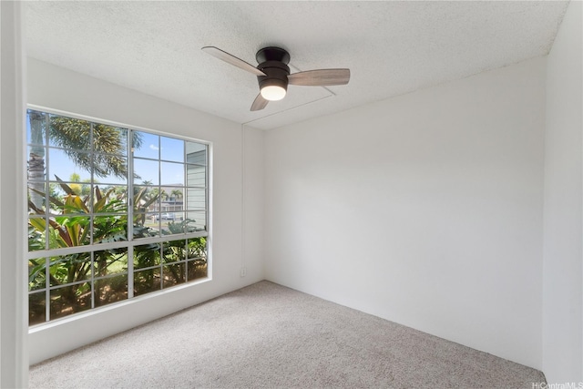 94-1467 Waipio Uka St Unit T103, Waipahu, HI 96797 - spare room featuring carpet flooring, a ceiling fan, and a textured ceiling