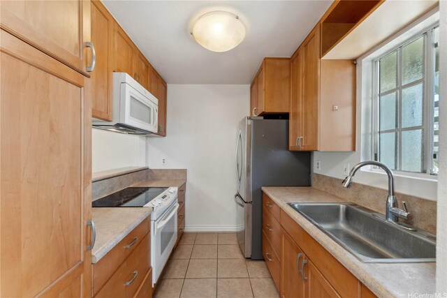 94-1467 Waipio Uka St Unit T103, Waipahu, HI 96797 - kitchen with white appliances, a sink, light tile patterned floors, baseboards, and light countertops