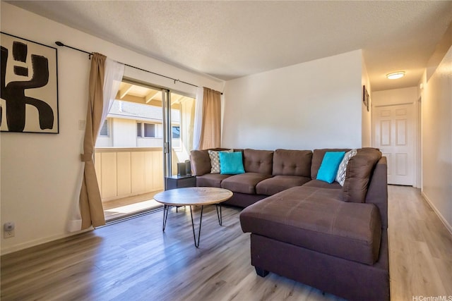 94-1147 Mopua Loop Unit K8, Waipahu, HI 96797 - living area featuring wood finished floors and a textured ceiling