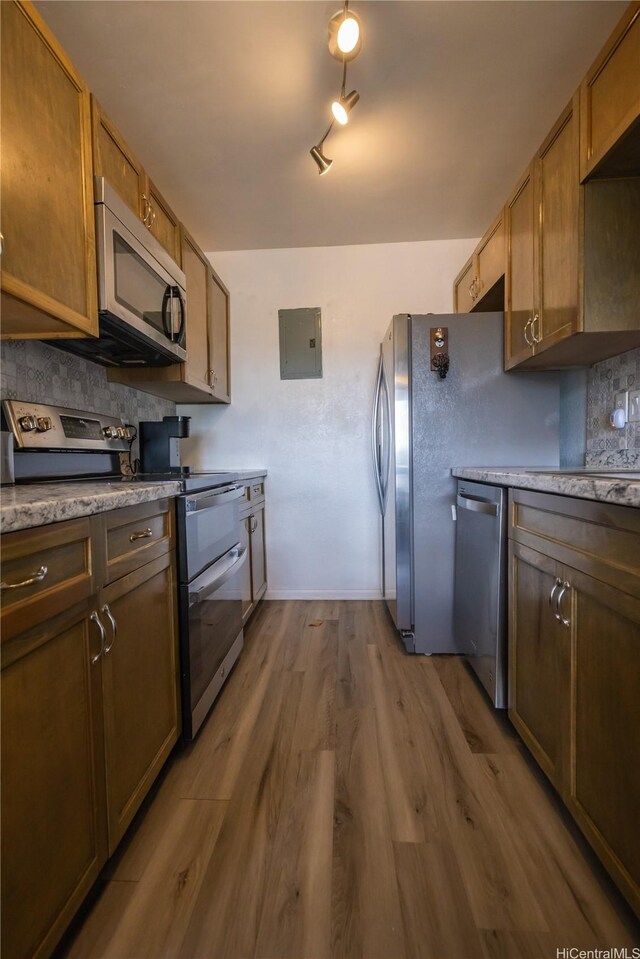 94-1147 Mopua Loop Unit K8, Waipahu, HI 96797 - kitchen featuring appliances with stainless steel finishes, wood finished floors, electric panel, and tasteful backsplash