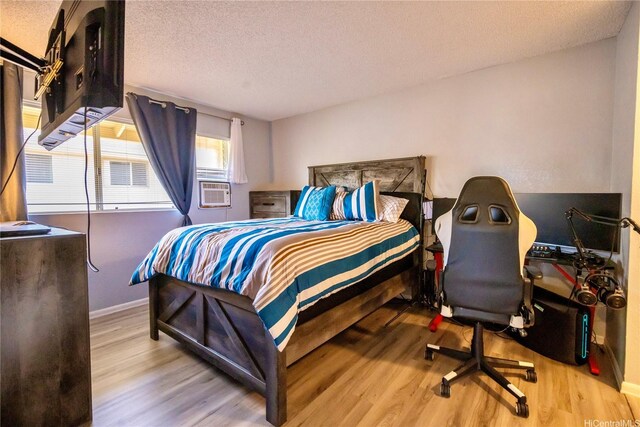 94-1147 Mopua Loop Unit K8, Waipahu, HI 96797 - bedroom with wood finished floors, a textured ceiling, and cooling unit