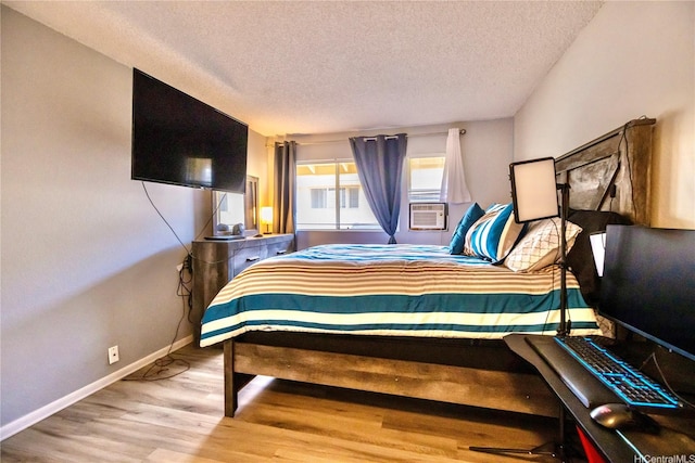 94-1147 Mopua Loop Unit K8, Waipahu, HI 96797 - bedroom with a textured ceiling, wood finished floors, and cooling unit