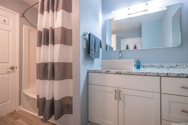 94-1147 Mopua Loop Unit K8, Waipahu, HI 96797 - full bathroom featuring wood finished floors, vanity, and shower / bathtub combination with curtain