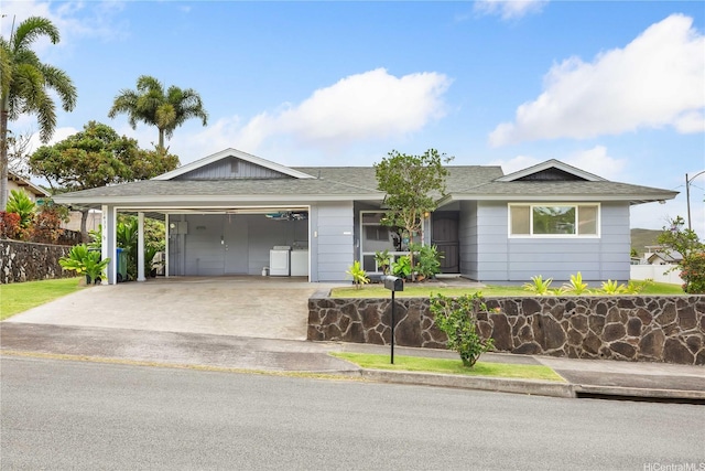 1433 Akanahe Pl, Kailua, HI 96734 - ranch-style home with concrete driveway, a garage, roof with shingles, and washer / dryer