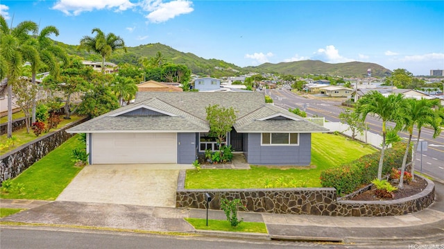 1433 Akanahe Pl, Kailua, HI 96734 - ranch-style house with roof with shingles, a mountain view, driveway, and an attached garage