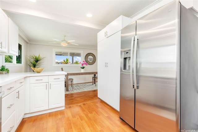 1433 Akanahe Pl, Kailua, HI 96734 - kitchen featuring stainless steel fridge with ice dispenser, light wood-type flooring, white cabinets, light countertops, and recessed lighting