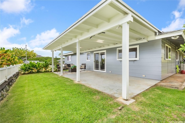 1433 Akanahe Pl, Kailua, HI 96734 - rear view of house with a patio area and an outdoor hangout area