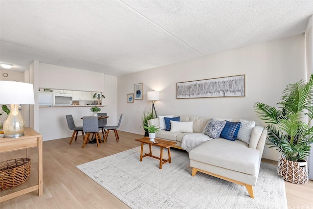 400 Hobron Ln Unit 1807, Honolulu, HI 96815 - living area with light wood-style floors and a textured ceiling