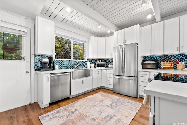 4130 Keanu St Unit 4, Honolulu, HI 96816 - kitchen featuring stainless steel appliances, light countertops, tasteful backsplash, and a wood ceiling with exposed beams