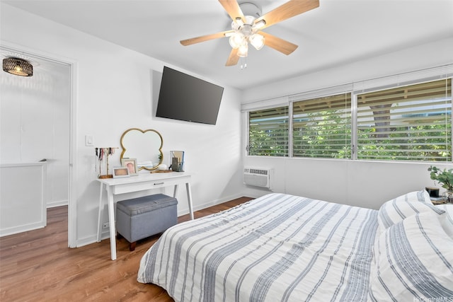 4130 Keanu St Unit 4, Honolulu, HI 96816 - bedroom with wood finished floors, a wall mounted AC, and ceiling fan