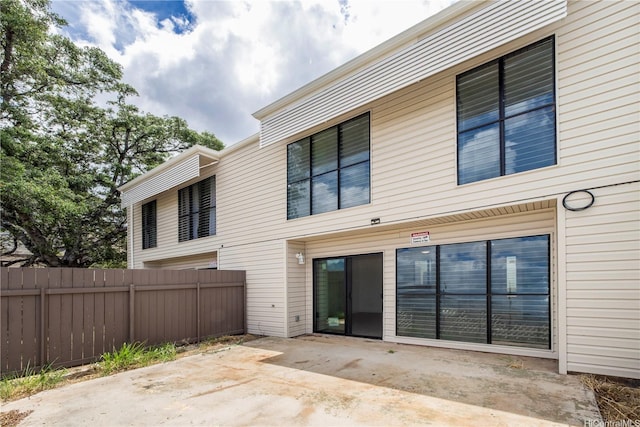 rear view of house featuring a patio
