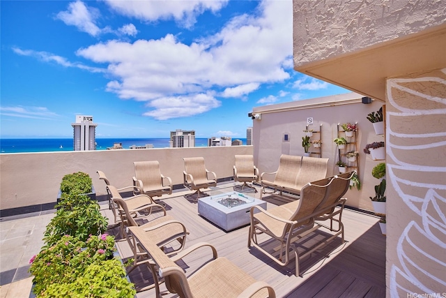 2345 Ala Wai Blvd Unit 2210, Honolulu, HI 96815 - view of patio / terrace featuring an outdoor fire pit and a deck with water view