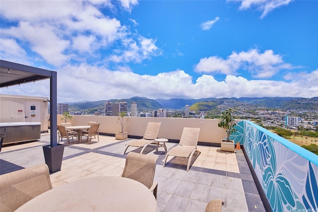 2345 Ala Wai Blvd Unit 2210, Honolulu, HI 96815 - view of patio / terrace with outdoor dining area, a mountain view, and a city view
