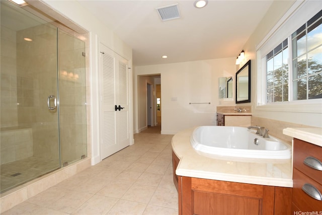 91-1342 Kaiokia St, Ewa Beach, HI 96706 - bathroom with a stall shower, tile patterned floors, a bath, vanity, and a closet