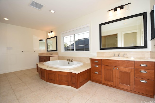 91-1342 Kaiokia St, Ewa Beach, HI 96706 - bathroom with two vanities, a bath, tile patterned floors, and recessed lighting