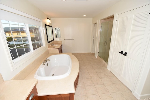 91-1342 Kaiokia St, Ewa Beach, HI 96706 - bathroom featuring a shower stall, vanity, tile patterned flooring, a bath, and a closet