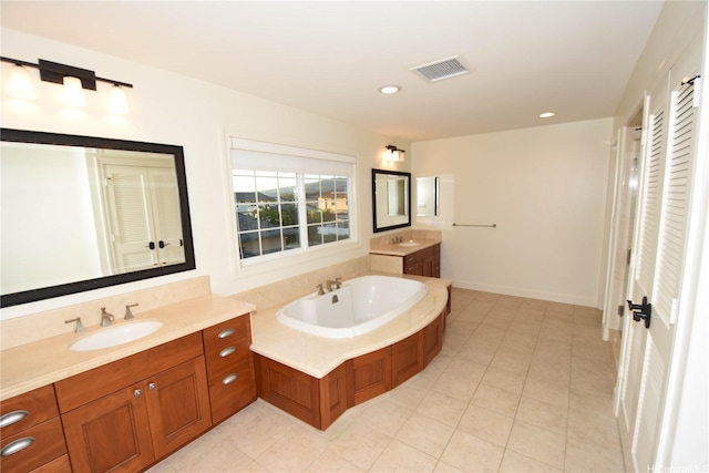 91-1342 Kaiokia St, Ewa Beach, HI 96706 - full bath with two vanities, a garden tub, tile patterned floors, and recessed lighting
