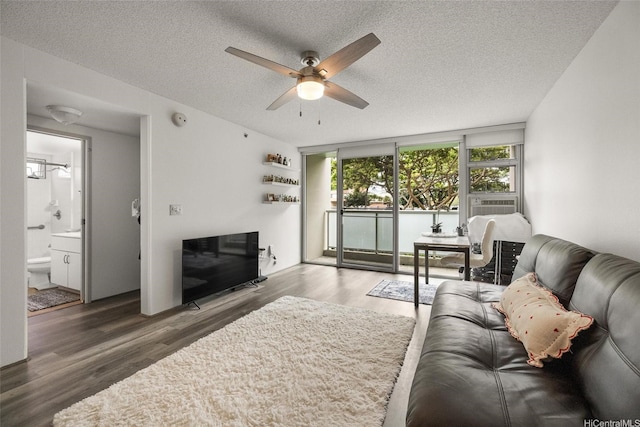 3009 Ala Makahala Pl Unit 214, Honolulu, HI 96818 - living area with a ceiling fan, wood finished floors, and a textured ceiling
