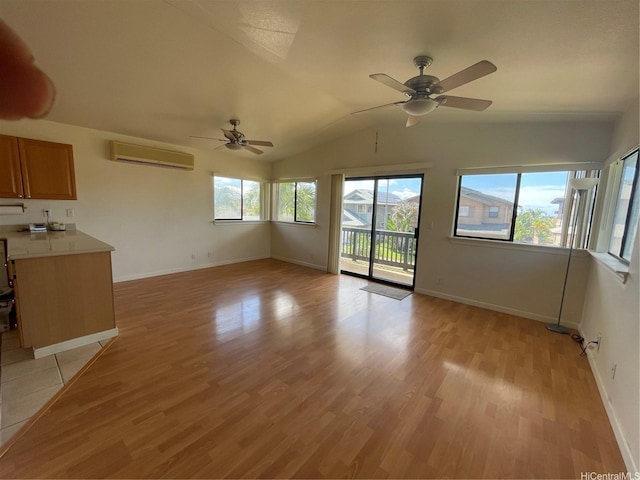 91-1088 Paaoloulu Way, Kapolei, HI 96707 - unfurnished living room with a wall unit AC, a ceiling fan, light wood finished floors, and vaulted ceiling