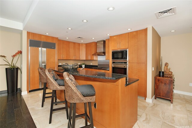 1288 Ala Moana Blvd Unit 18B, Honolulu, HI 96814 - kitchen featuring built in appliances, wall chimney exhaust hood, a kitchen bar, brown cabinets, and recessed lighting