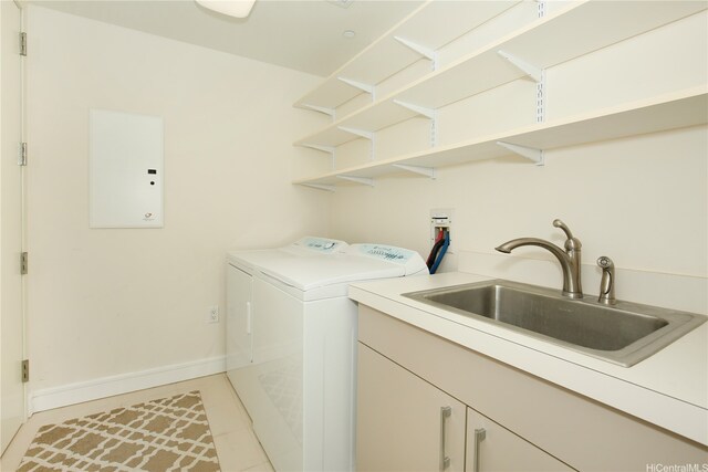 1288 Ala Moana Blvd Unit 18B, Honolulu, HI 96814 - laundry room featuring light tile patterned floors, washing machine and dryer, cabinet space, and electric panel