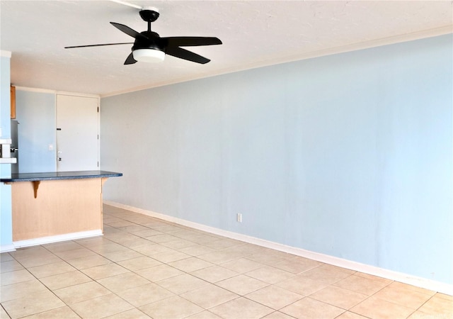 95-2057 Waikalani Pl Unit C403, Mililani, HI 96789 - kitchen featuring dark countertops, a kitchen breakfast bar, a ceiling fan, ornamental molding, and a peninsula