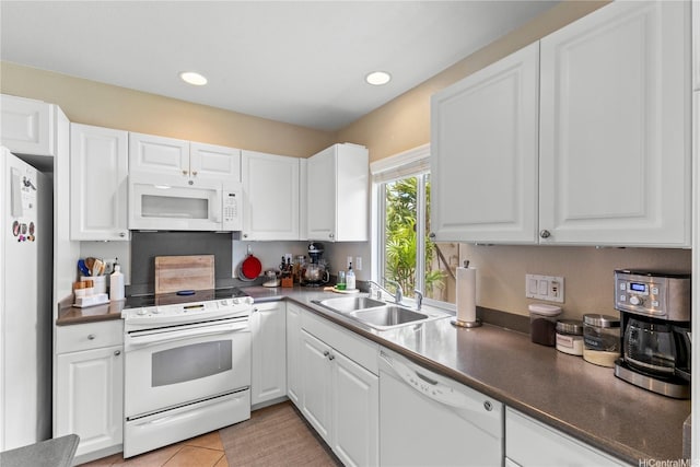 91-6438 Kapolei Pkwy, Ewa Beach, HI 96706 - kitchen featuring white appliances, white cabinets, recessed lighting, and dark countertops