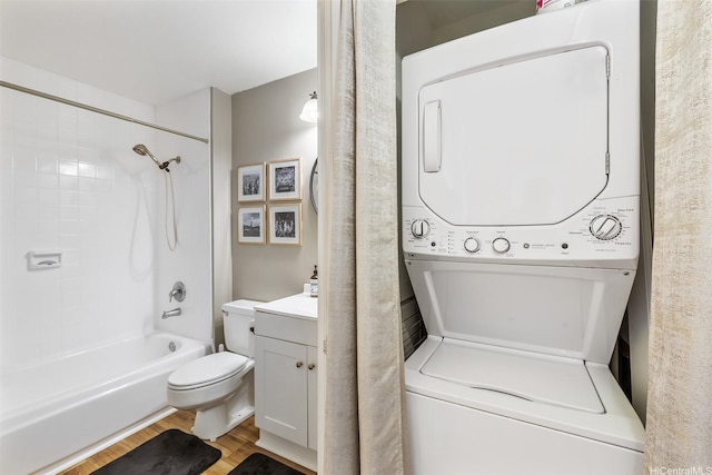 3045 Ala Napuaa Pl Unit 1803, Honolulu, HI 96818 - full bathroom with stacked washing machine and dryer, wood finished floors, vanity, and tub / shower combination