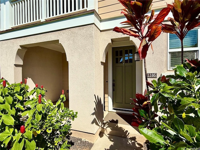 91-2220 Kaiwawalo St Unit 11-1105, Ewa Beach, HI 96706 - property entrance featuring stucco siding and a balcony