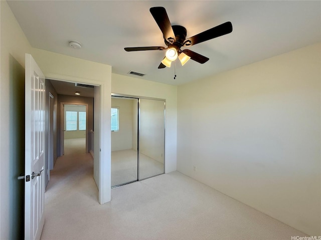 91-2220 Kaiwawalo St Unit 11-1105, Ewa Beach, HI 96706 - unfurnished bedroom featuring light colored carpet, a closet, and a ceiling fan