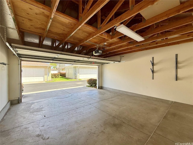 91-2220 Kaiwawalo St Unit 11-1105, Ewa Beach, HI 96706 - garage with a garage door opener and baseboards