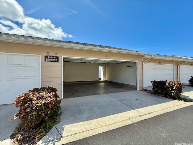 91-2220 Kaiwawalo St Unit 11-1105, Ewa Beach, HI 96706 - garage featuring concrete driveway