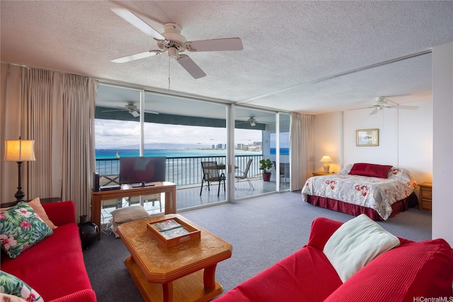 2877 Kalakaua Ave Unit 804, Honolulu, HI 96815 - carpeted bedroom with a textured ceiling, access to outside, a ceiling fan, and floor to ceiling windows