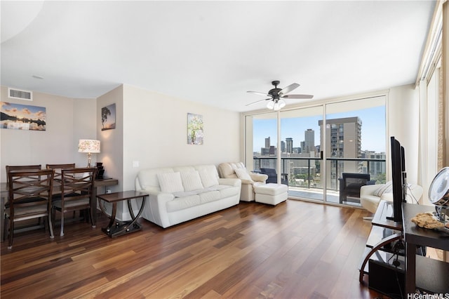 1837 Kalakaua Ave Unit 2001, Honolulu, HI 96815 - living area featuring dark wood-type flooring, ceiling fan, and expansive windows