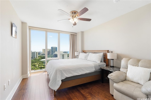 1837 Kalakaua Ave Unit 2001, Honolulu, HI 96815 - bedroom featuring dark wood-style flooring, a city view, and ceiling fan
