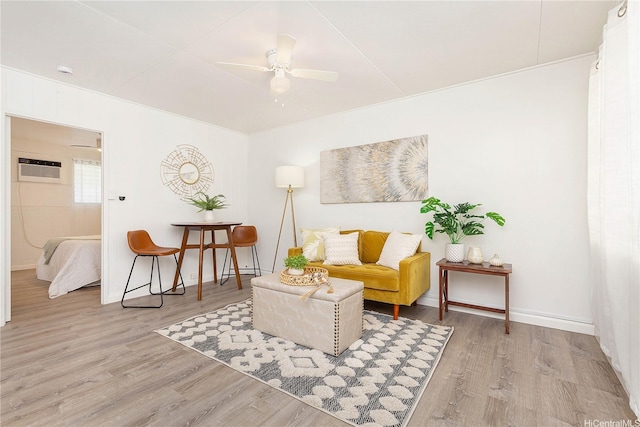 1808 Waiola St Unit 6, Honolulu, HI 96826 - sitting room featuring wood finished floors, a ceiling fan, and a wall unit AC