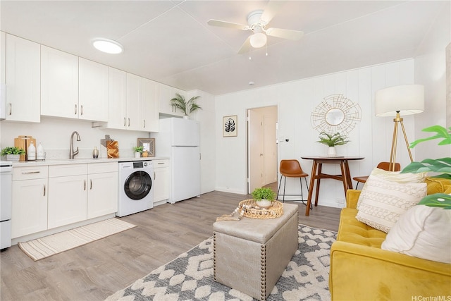 1808 Waiola St Unit 6, Honolulu, HI 96826 - living room featuring washer / dryer, light wood-type flooring, and ceiling fan