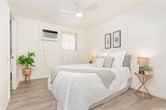 1808 Waiola St Unit 6, Honolulu, HI 96826 - bedroom featuring light wood-style flooring, a wall mounted AC, and ceiling fan