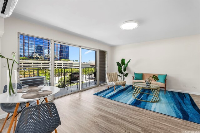 731 Amana St Unit 703, Honolulu, HI 96814 - sitting room featuring wood finished floors and baseboards
