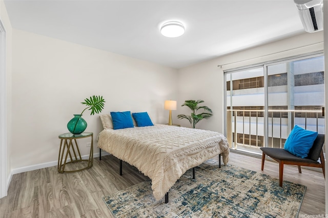 731 Amana St Unit 703, Honolulu, HI 96814 - bedroom featuring wood finished floors and access to exterior