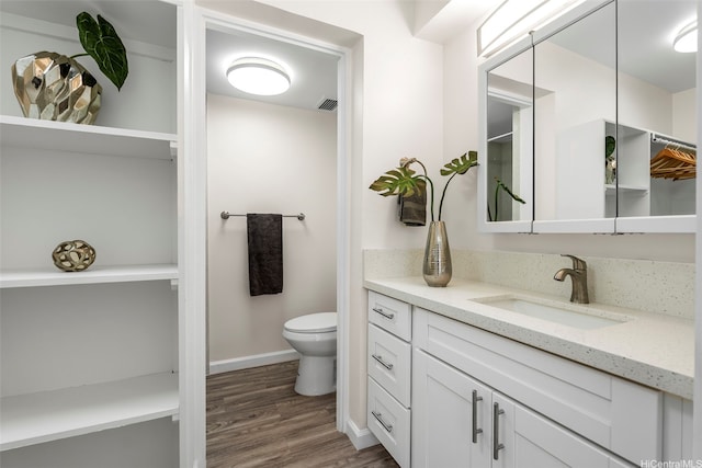 731 Amana St Unit 703, Honolulu, HI 96814 - bathroom featuring vanity, wood finished floors, and a shower