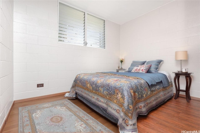 715 Umi St Unit 2B, Honolulu, HI 96819 - bedroom featuring wood finished floors and baseboards