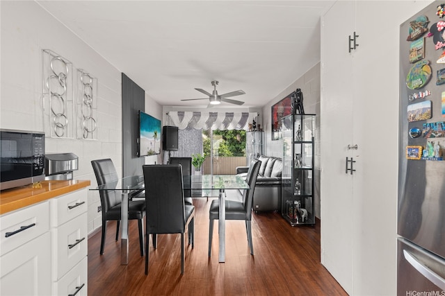 715 Umi St Unit 2B, Honolulu, HI 96819 - dining space with ceiling fan and dark wood-type flooring